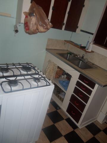 Small kitchen with a white gas stove